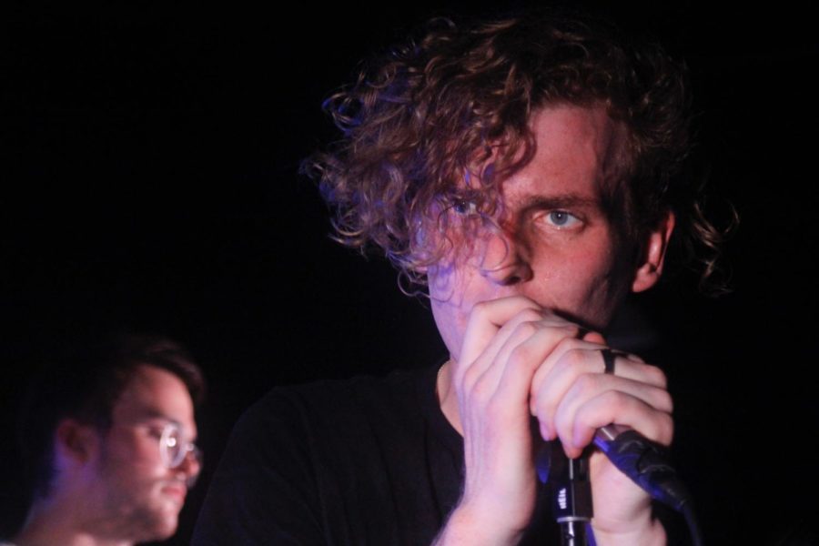 Chase Lawrence looks into the crowd during Coin's performance at the Mshop. Coin kicked off their 2017 tour in Ames, on Wednesday April 19. Lawrence said that this was their first tour, that they weren't the opening act for. 