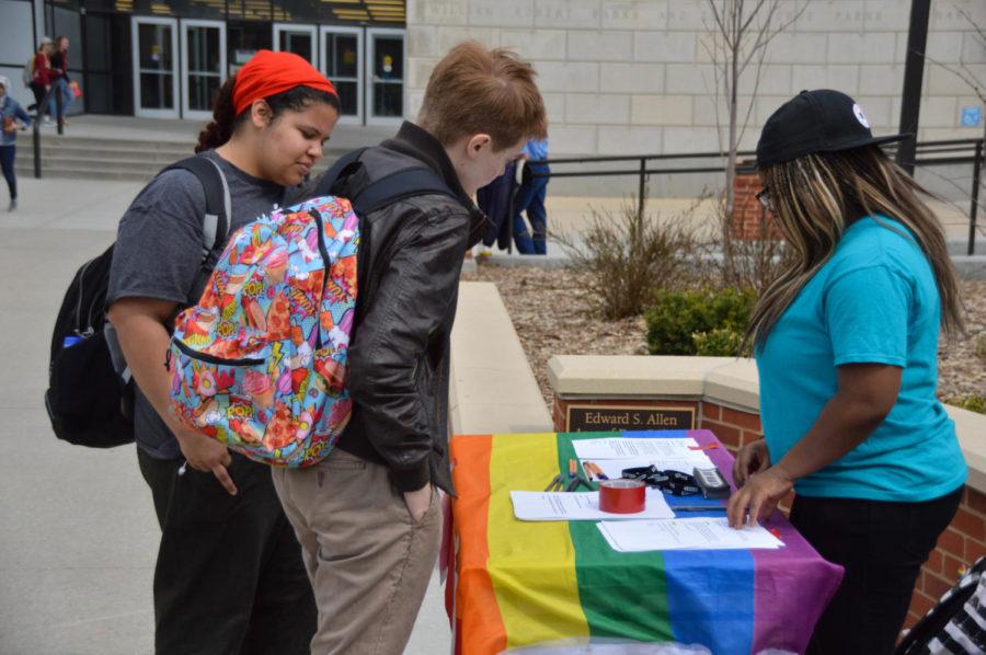 Kenz Roberts, a member of the ISU Pride Alliance, speaks to students in the Agora on April 13. In honor of Pride week, Pride Alliance had a booth set up to inform others about political awareness and promote it across campus. At the booth, students had the chance to write to their representatives about various issues. 