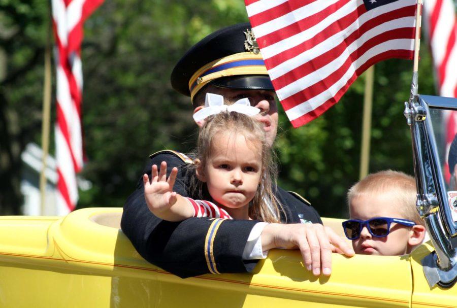 Parade Marshall Captain Aaron Rosheim and his children enter the cemetery to begin the Memorial Day service on May 29.