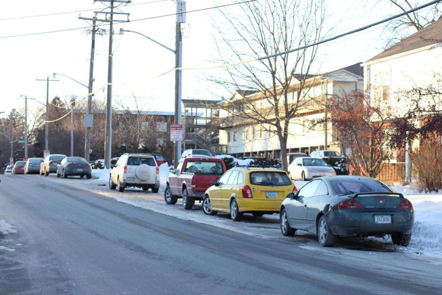 The City of Ames and Campustown are looking at options for better parking and less congestion. Cars parked along Knapp Street on Jan. 12, 2015 dodge snow banks and slick roads.