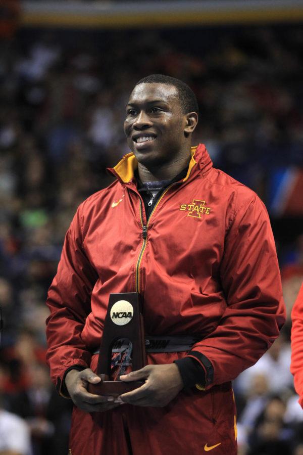 Iowa States Kyven Gadson accepts his 197-pound NCAA Championship title at the Scottrade Center in St. Louis, Mo. on March 21. Gadson pinned Snyder in 4:24. David Scrivner / Iowa City Press-Citizen