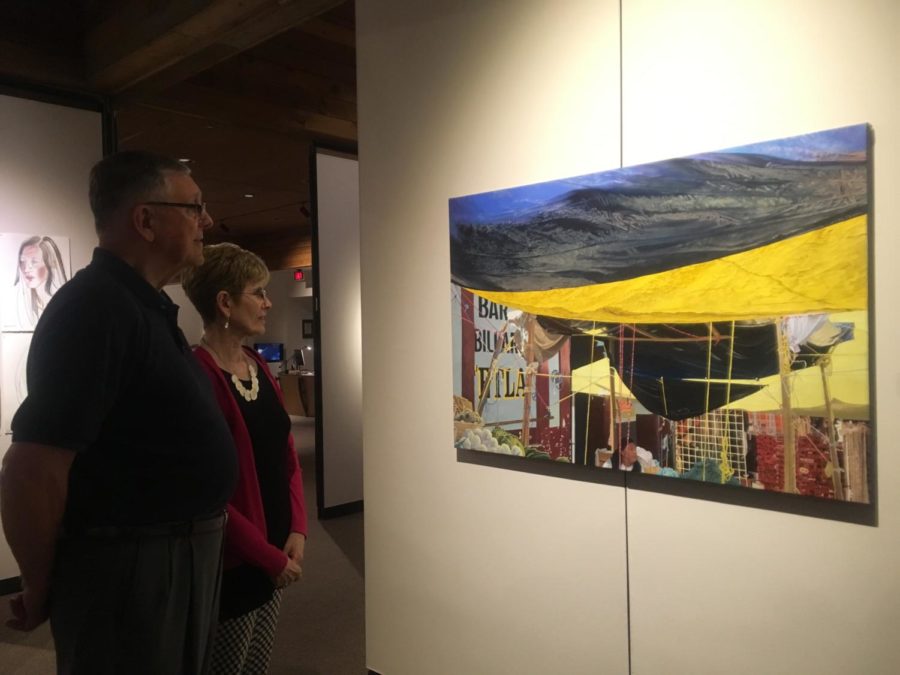 Diane Patton and Jim Patton were looking at a painting of marketplace