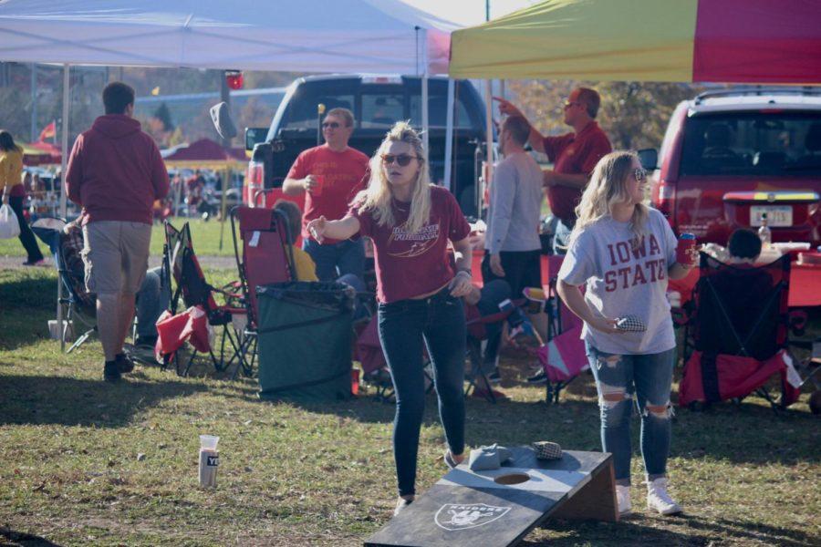 Iowa State Football fans played bags during their tailgate. Fans tailgated before the Iowa State Football game against the Oklahoma Sooners on Nov. 3. 