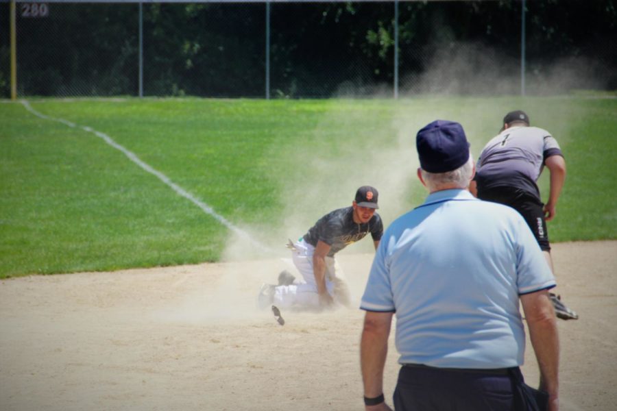 A player slid his way to third base during the Iowa Games on July 23.