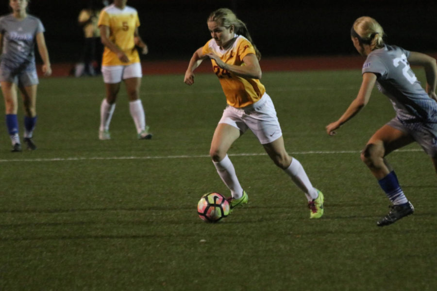 Iowa State freshman Hannah Cade pushes the ball up field against Drake on Oct. 18.