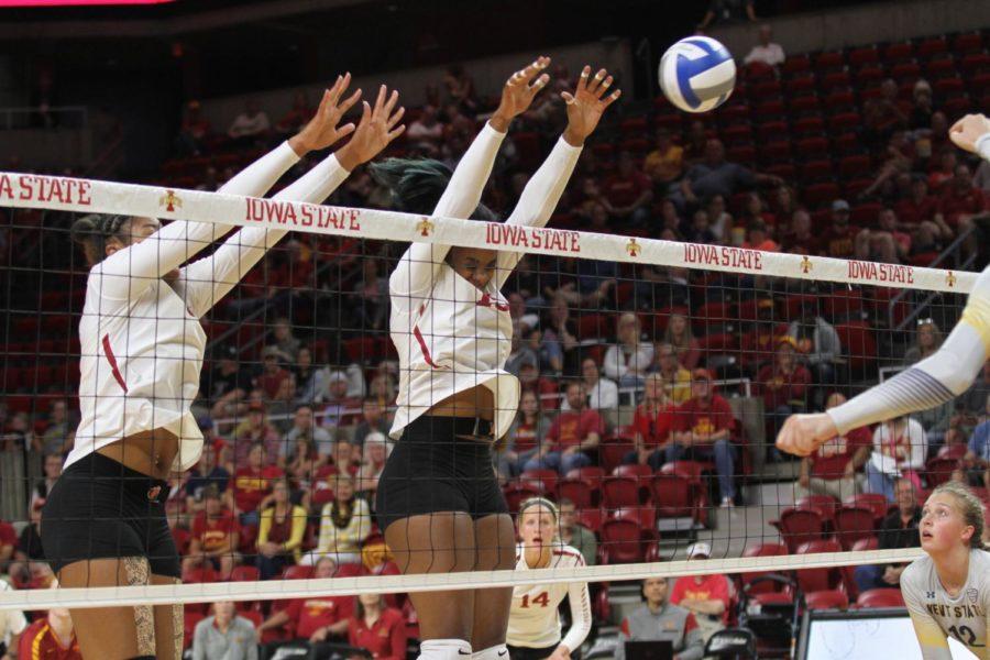 Samara West and Grace Lazard jump for the ball during a match against Kent State on Aug. 25 in Hilton Coliseum. Cyclones went on to sweep Kent State 3-0 in their first match of the season. 