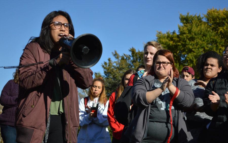 A student speaks to a group of protesters around the immigration statue on Central Campus Nov. 11. Students and staff gathered together for a Not My President protest, where anyone was welcome to come up and speak their frustrations. 