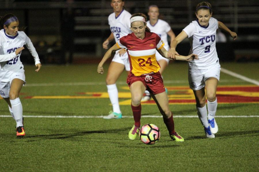 Freshman Hannah Cade protects the ball against a TCU player. Iowa State womens soccer played against the TCU Horned Frogs on Oct. 7.