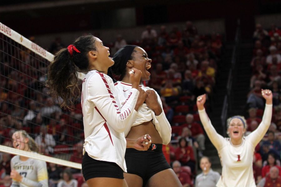Genesis Miranda, Grace Lazard and Hannah Bailey celebrate after winning the second set during their match on Aug. 25 in Hilton Coliseum. Cyclones went on to sweep Kent State 3-0 in their first match of the season. 