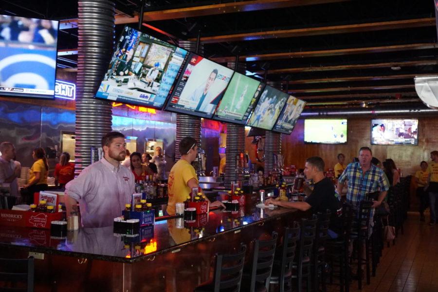 Customers sit at the bar of the new Jethro's location on Thursday during the restaurant's grand opening. The Ames location is the seventh to open under the Jethro's name, the first being in the Drake university area in Des Moines, according to the restaurant's website.