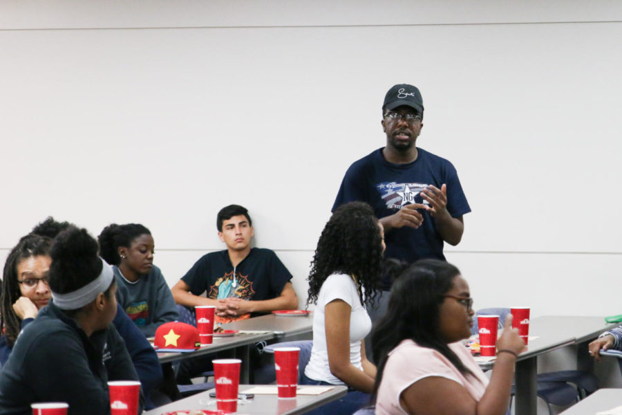 Malik Burton, junior in speech communication and president of Black Student Alliance, poses a question during the NAACP community discussion Nov. 1 in Carver Hall. The event gave students the opportunity to address concerns about the posters containing white heritage messages Oct. 27. 