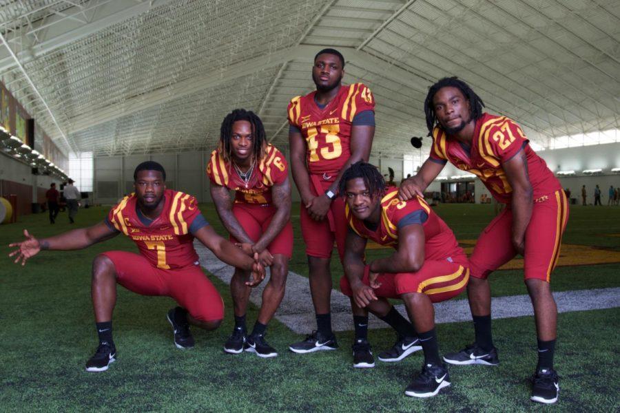 Reggan Northrup, Tymar Sutton, Willie Harvey, De'Monte Ruth and Romelo Webster pose during football media day in the Bergstrom Football Complex on Aug. 3. 