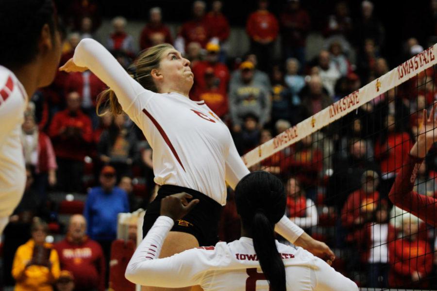 Iowa State middle back Alexis Conaway spikes the ball against Oklahoma on Nov. 26 in Hilton Coliseum. Led by the seniors, Iowa State swept Oklahoma in 3 sets.
