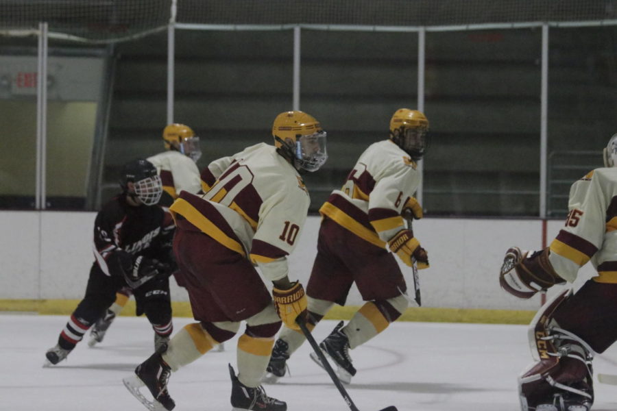 Freshmen+Justin+Paulson+goes+toward+the+puck+on+Sept.+23.+The+Cyclones+defeated+Illinois+State+4-1.