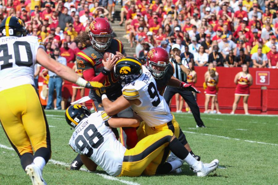Iowa State quarterback Jacob Park gets sacked by Iowas Anthony Nelson (98) and A.J. Epenesa (94) on Sept. 9, 2017.