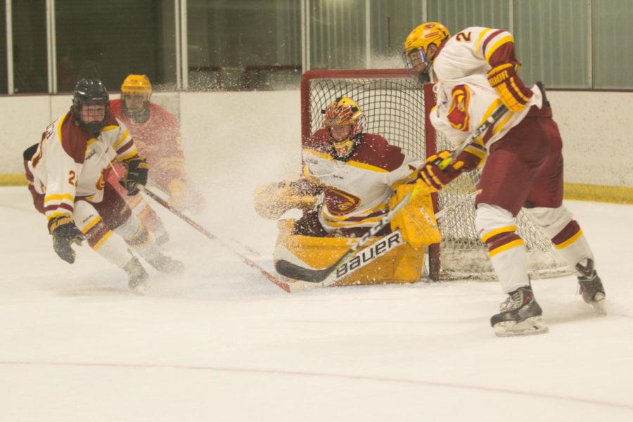 Members of the Cyclone Hockey defend their goal Sept. 15 during the Cardinal and Gold Team Scrimmage.  Gold Team won over Cardinal 5-2.