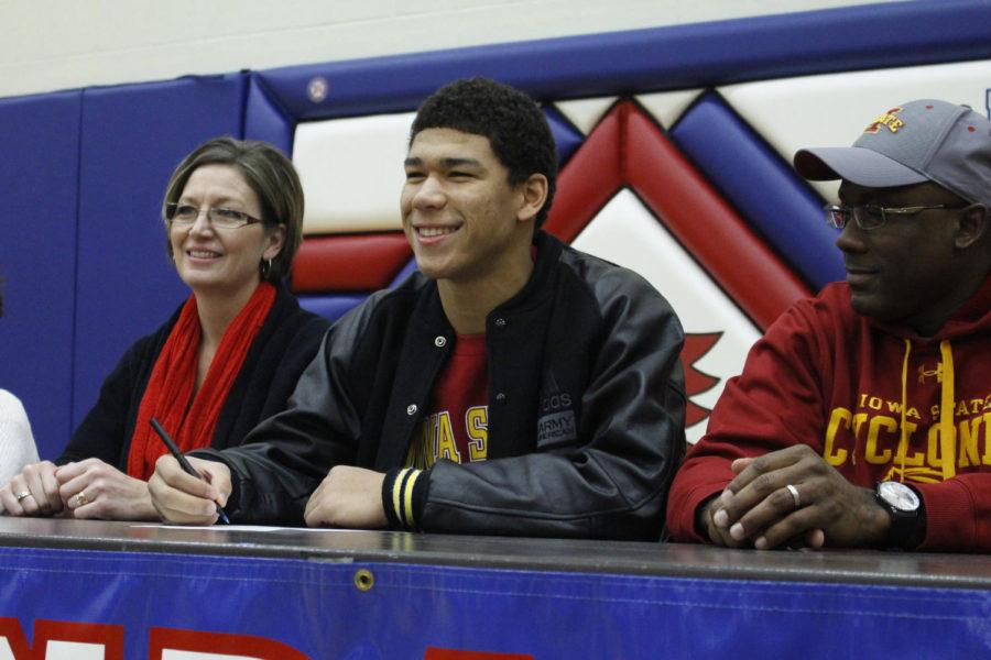 Urbandale senior Allen Lazard, who sits with his parents Kevin and Mary, mock signs his National Letter of Intent after officially becoming a member of the Iowa State football program in the fall of 2014.
