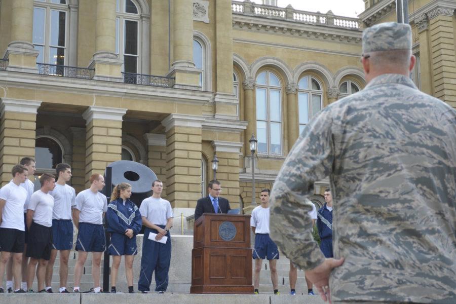Captain Daniel Torrence looks on as Lieutenant Governor of Iowa, Adam Gregg, acknowledges members of the Iowa State Air Force ROTC before they run 32 miles for National POW/MIA Recognition Day on Sept. 15. The Air Force ROTC members ran from the Capitol Building in Des Moines to Iowa State University in Ames.