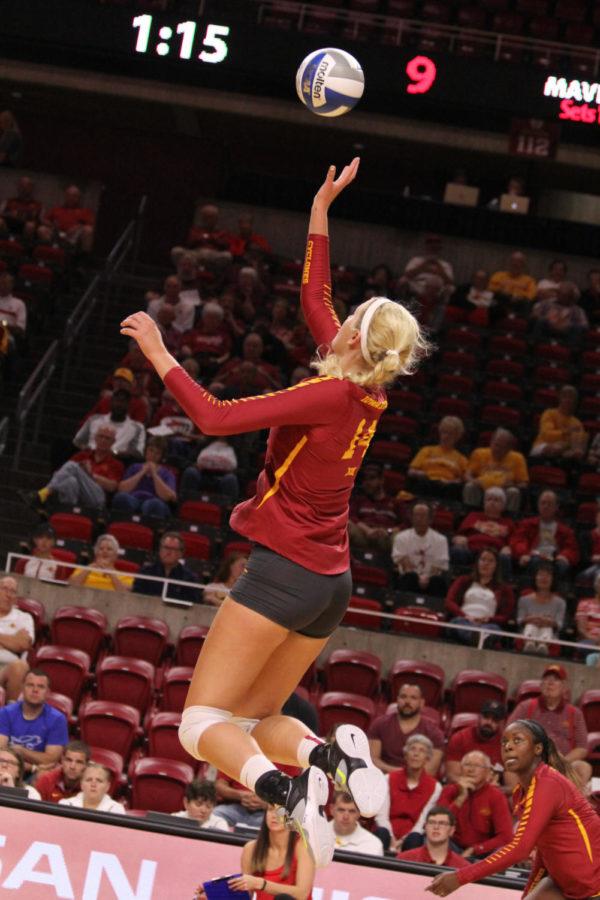 Junior Jess Schaben taps the ball over the net Aug. 26. The Cyclones went on to sweep Omaha in thee consecutive sets. 