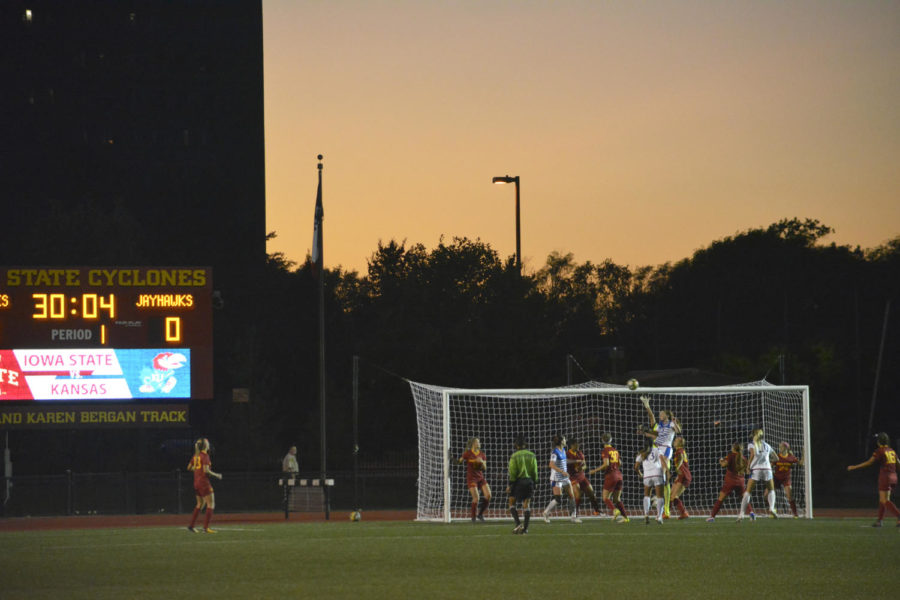 Soccer players go for the ball after a corner kick. The Iowa State soccer team played against Kansas on Sept. 29 and lost 2-1.