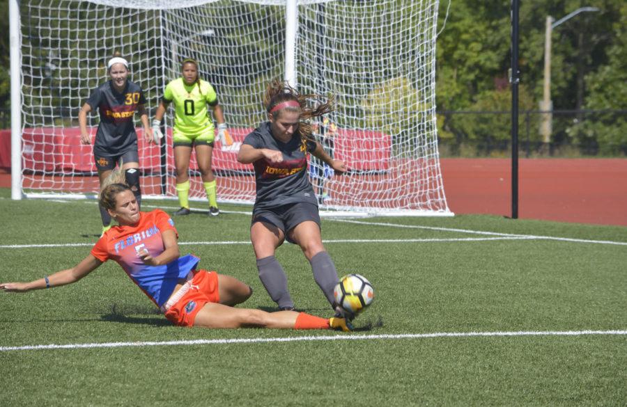 Emily Steil, midfielder, tries to secure the ball during the last minute of the second half against the Florida Gators. The game went into overtime after the second half ended 1-1 on Sunday afternoon.