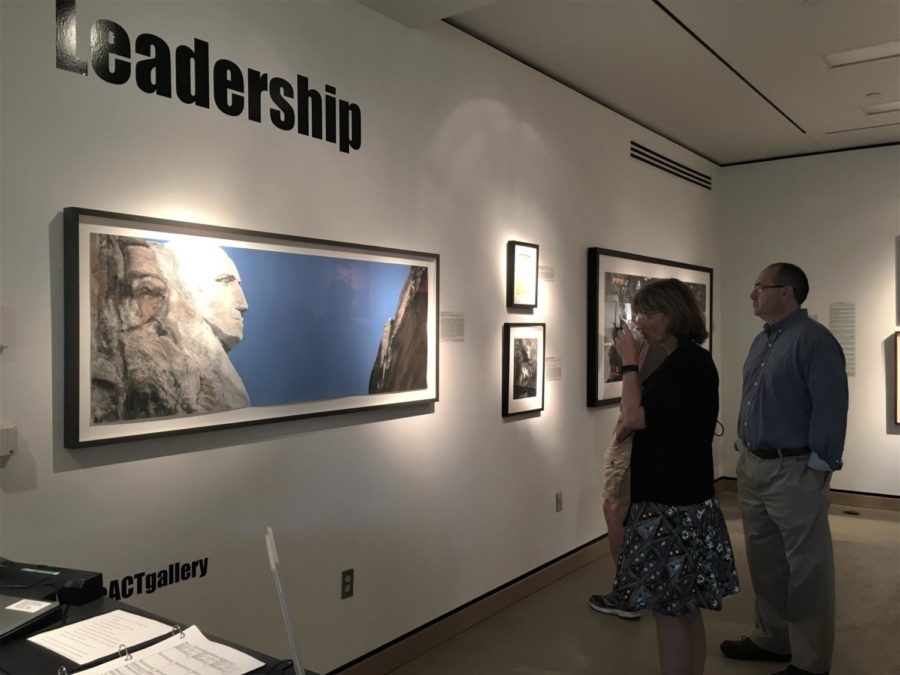 Kickoff-goers view the leadership themed wall in the gallery, largely occupied by a photograph of Mount Rushmore from the side, showing only George Washingtons carved bust.