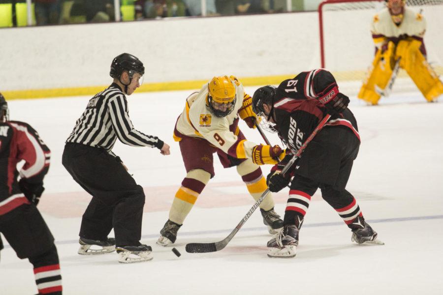 Member of the Cyclone Hockey club team battle for the puck Sept. 22 during their first official game of the season against Illinois State. The cyclones won 4-1 with three of the four goals happening in the third period.