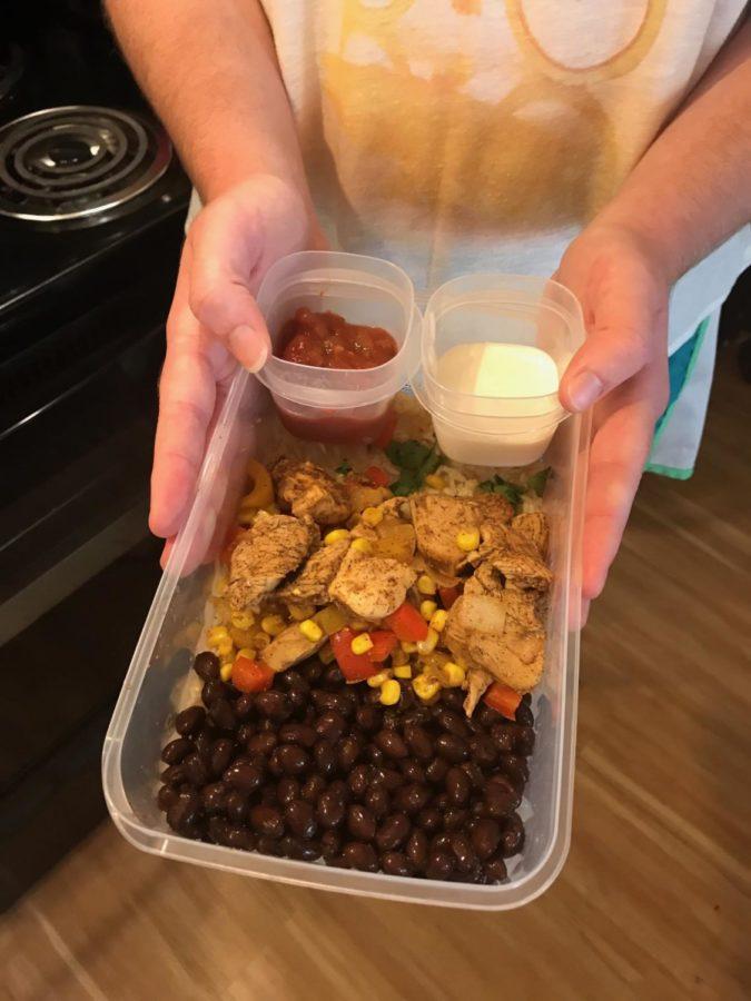 The+Tex-Mex+chicken+bowl+combines+cilantro+rice%2C+spicy+chicken+and+mixed+vegetables+with+sides+of+sour+cream+and+salsa+to+mix+in.%C2%A0