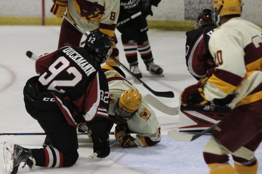 Sophomore Tommy Hanson falls to the ice during a game against Illinois State University on Sept. 23. The Cyclones defeated Illinois State 4-1.