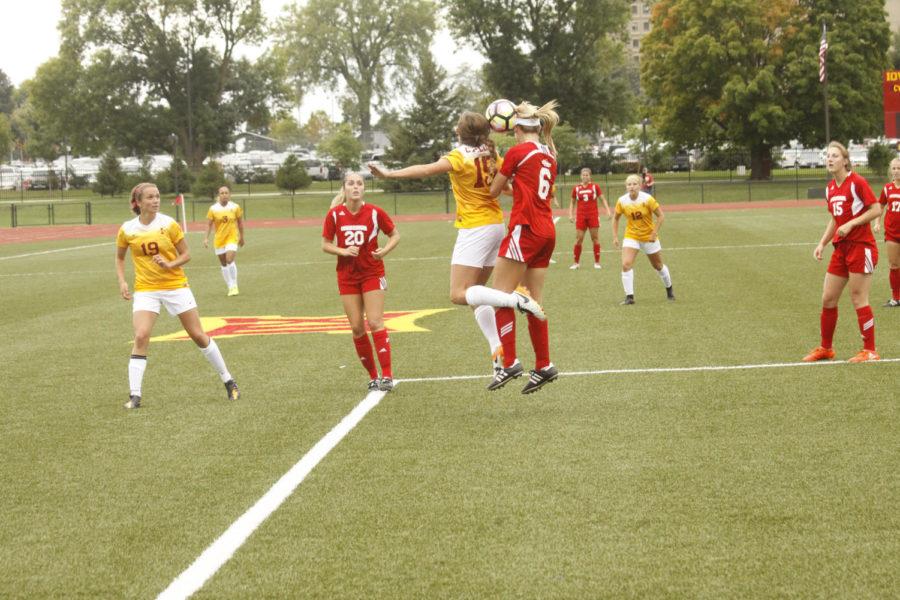 Iowa State senior Mia Mcaleer and South Dakotas Tayler Karas meet the ball in the air after a throw-in. The Cyclones would go on to win 2-0.
