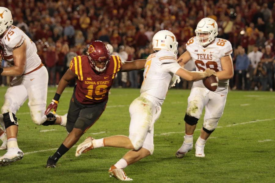Texas quarterback Shane Buechele escapes from Iowa State defensive end JaQuan Bailey. Buechele improvised on the play and turned it into a conversion on 3rd and 21.