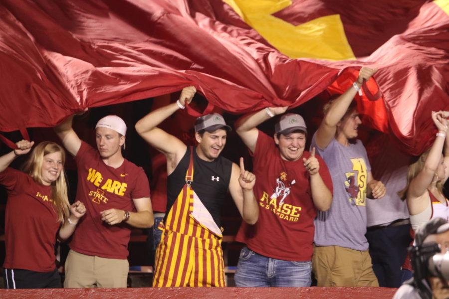 Iowa State fans cheer and hold up the Cyclone Power banner after an Iowa State touchdown against Northern Iowa.