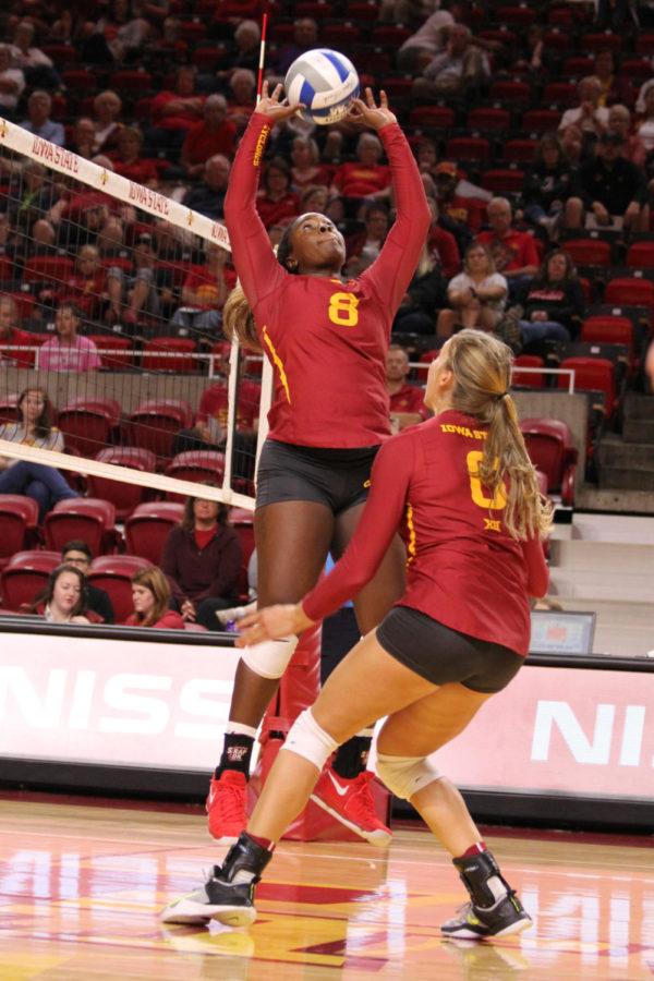 Senior Monique Harris sets the ball to senior Alexis Conaway Aug. 26. The Cyclones went on to sweep Omaha in thee consecutive sets. 