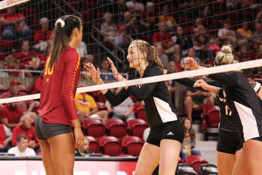 Freshman Avery Rhodes lines up at the net as she waits for the serve Aug. 26. The Cyclones went on to sweep Omaha in thee consecutive sets. 