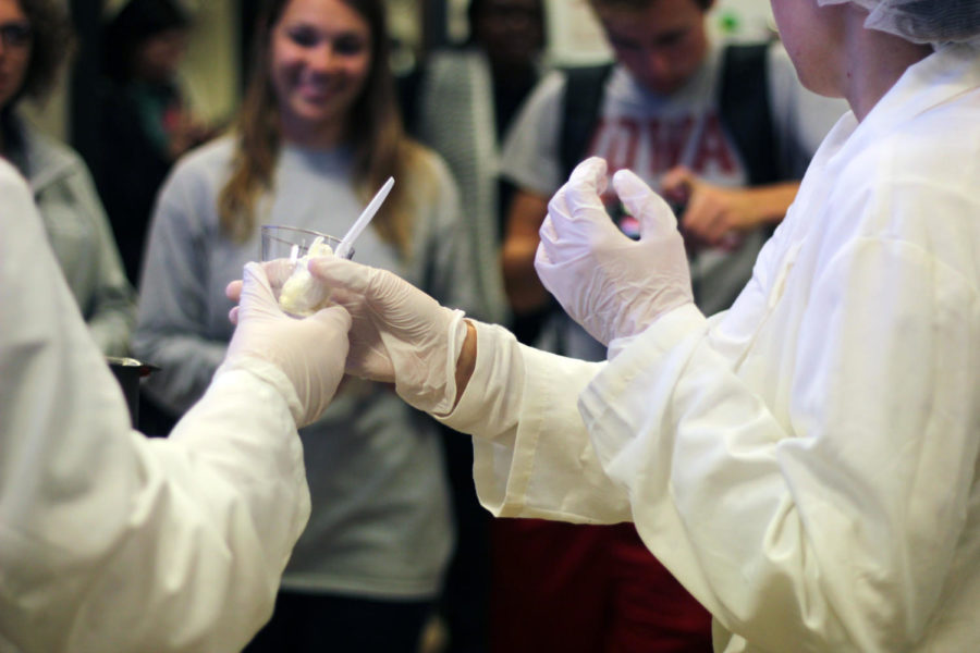 Food science club members hand out free ice cream they made using liquid Nitrogen in MacKay Hall on Wednesday.