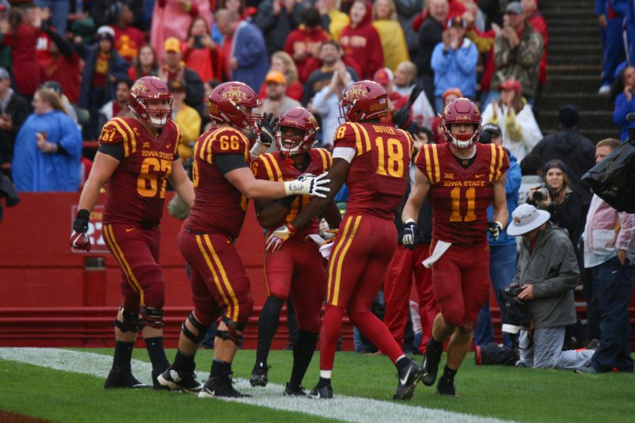 Iowa State football players celebrate a touchdown during their 45-0 win over Kansas on Oct. 14, 2017.