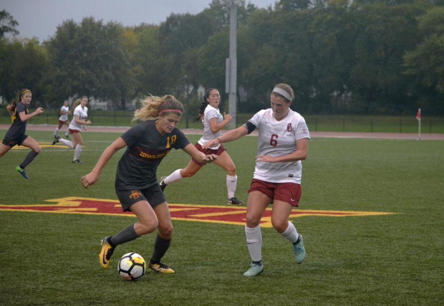 Klasey Medelberg, forward, tries to control the ball during the Cyclones versus Oklahoma game at the Cyclone Sports Complex on Oct. 6. After playing in on and off rain showers the game ended 0-0 in double overtime.