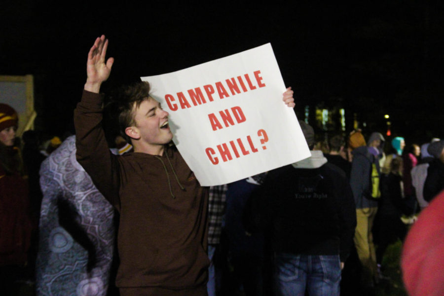 A student brings a sign that reads, Campanile and Chill? to the long-standing Iowa State Homecoming tradition of bringing ones significant other to Central Campus on the Friday night of Homecoming Week and kissing them at the stroke of midnight, commonly refers to as Campaniling.