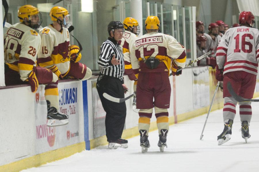 A ref talks to AJ Gullickson during the game against Oklahoma Oct. 6. The Cyclones defeated Oklahoma 3-1.