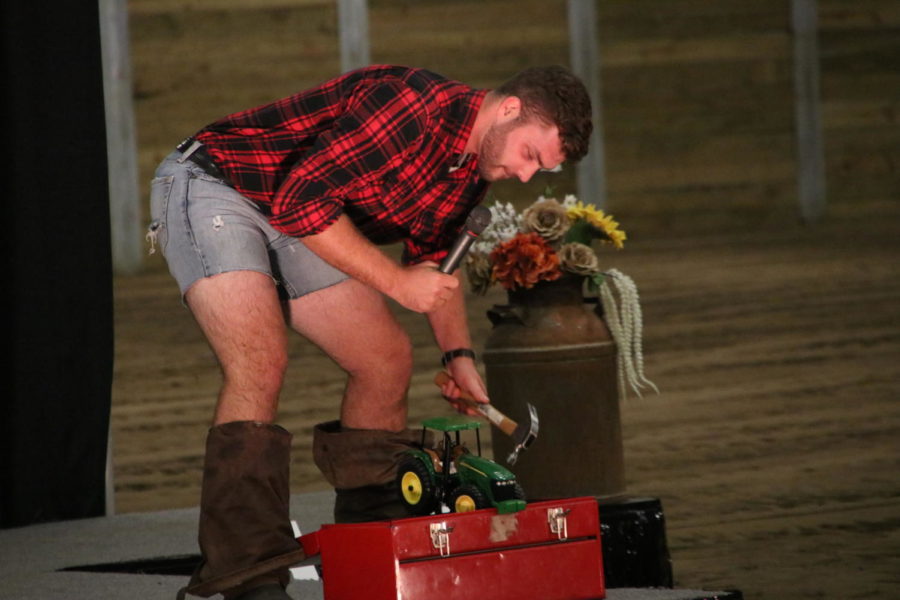 A contestant in the Mr. CALS competition shows how he would like to work on tractors in the future.
