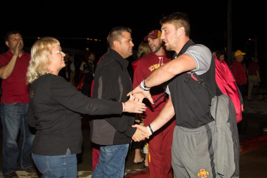 Joel Lanning high-fives fans after arriving back in Ames on Oct. 7, 2017, following Iowa States 38-31 win over Oklahoma.