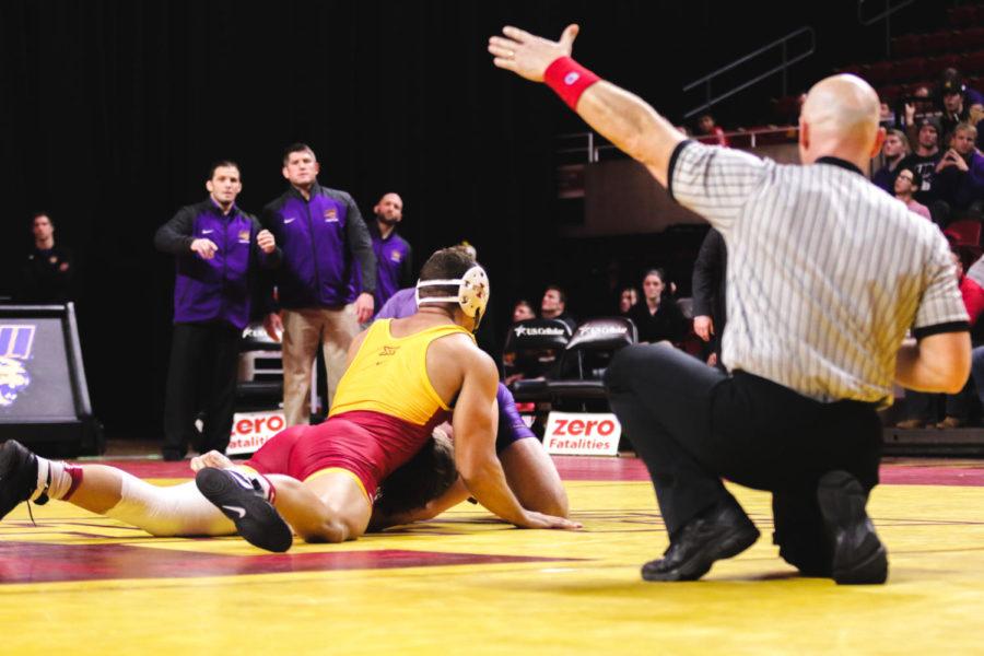 Marcus Harrington, a redshirt Sophmore at Iowa State, takes down Northern Iowas Chase Shedenhelm at Hilton Friday night.