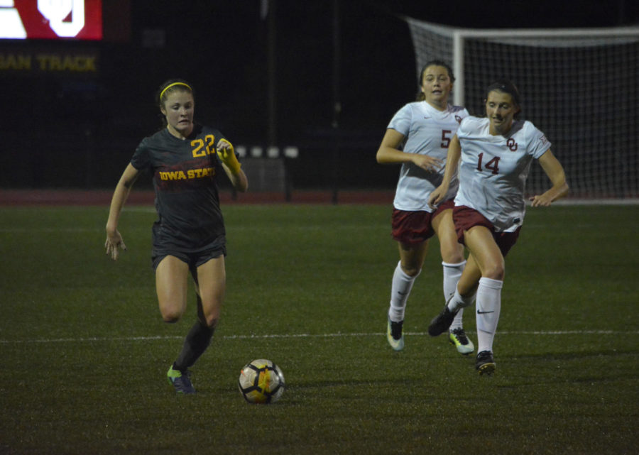 Courtney Powell, forward, runs the ball down the field during the Iowa State versus Oklahoma game at the Cyclone Sports Complex on Oct. 6, 2017. After playing in on-and-off rain showers the game ended 0-0 in double overtime.