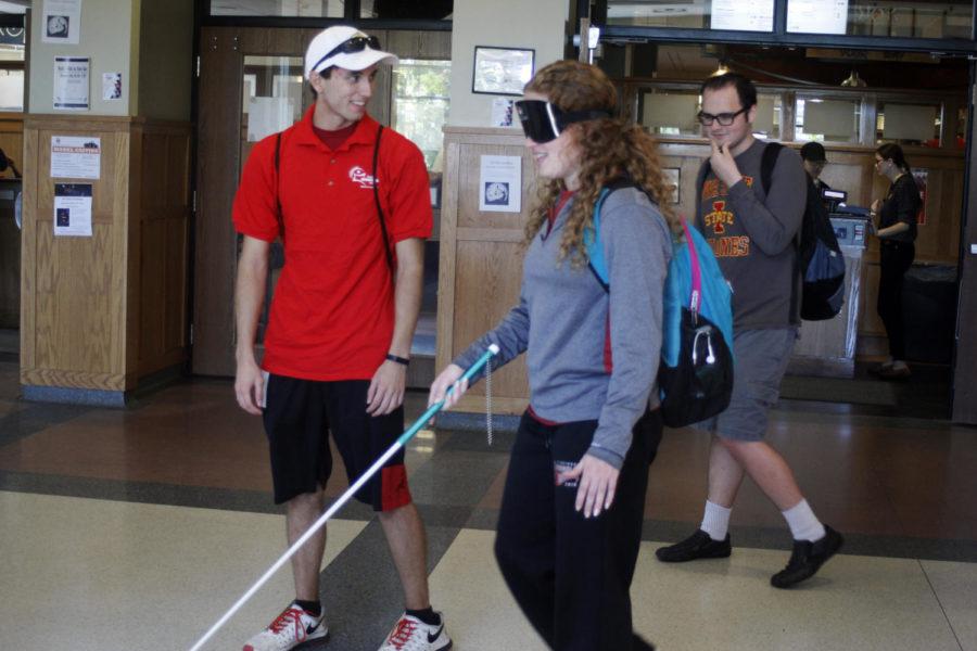 El Mayer, then-sophomore in business management, begins to walk using a cane and mask to eliminate her vision. Step Into My World was put on by the Alliance for Disability Awareness Club and the Student Disability Resource Center. The event was part of Disability Awareness Week in 2016. 