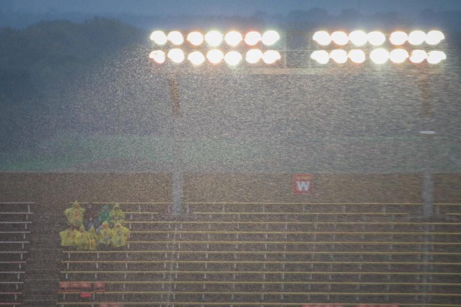 Cyclone fans sit in the rain before the game against Kansas on Oct. 14, 2017.