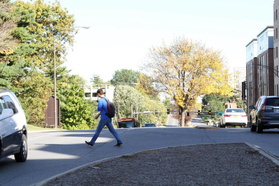 A student jaywalks across Lincoln Way on Oct. 17.