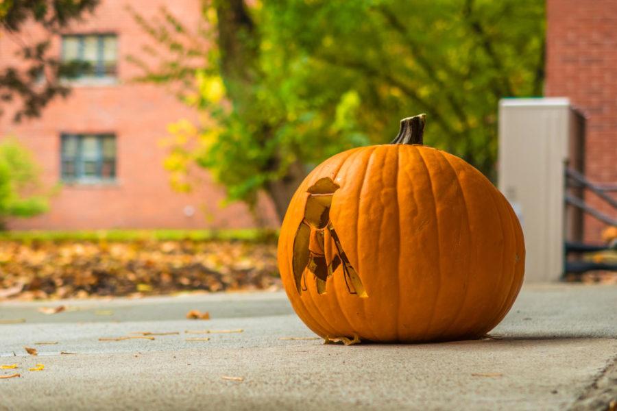 A carved pumpkin sits outside Helser Residence Hall on Oct. 26.