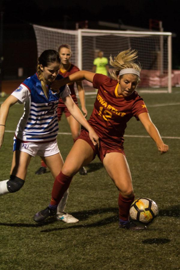 Midfielder Kasey Opfer tries to control the ball during the home opener for the Big 12 conference game versus Kansas on Sept. 29. The Iowa State soccer team lost 2-1.