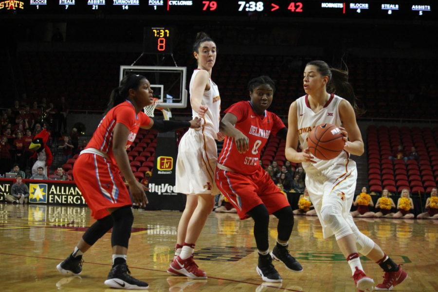 Junior Emily Durr (Left) blocks a Delaware Hornet while Freshman Adrianna Camber (Right) passes by another player to score a point. Iowa State Womens Basketball faced the Delaware Hornets on Dec. 18. Iowa State took home the win 88-57.