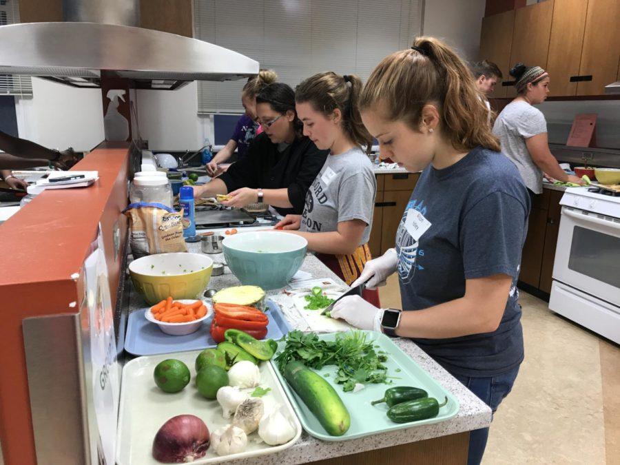 Participants practice their knife skills during the Culinary Boot Camp on Oct. 2.